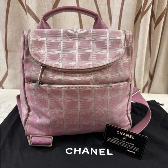 CHANEL Handbags - CHANEL Pink Quilted Logo Nylon Backpack